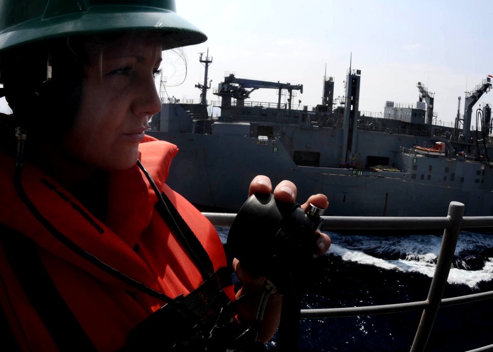 US Navy 110525-N-7508R-002 Boatswain's Mate Seaman Jennifer Patterson stands phone-talker watch aboard USS Bataan (LHD 5) during a replenishment at
