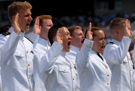 US Navy 110527-N-OA833-011 Navy ensigns take the oath of office during the U.S. Naval Academy Class of 2011 graduation and commissioning ceremony photo