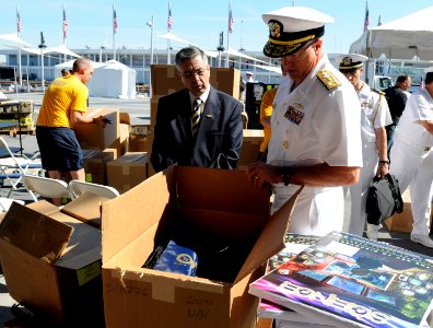 US Navy 110525-N-PO203-029 Paul Gido shows Vice Adm. Daniel P. Holloway some of the give-away items that the Office of Naval Research will hand out