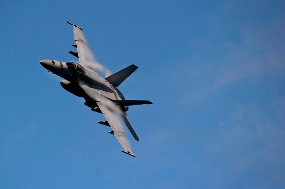 US Navy 110531-N-DR144-569 An F-A-18E Super Hornet assigned to Strike Fighter Squadron (VFA) 81 banks over the Nimitz-class aircraft carrier USS Ca