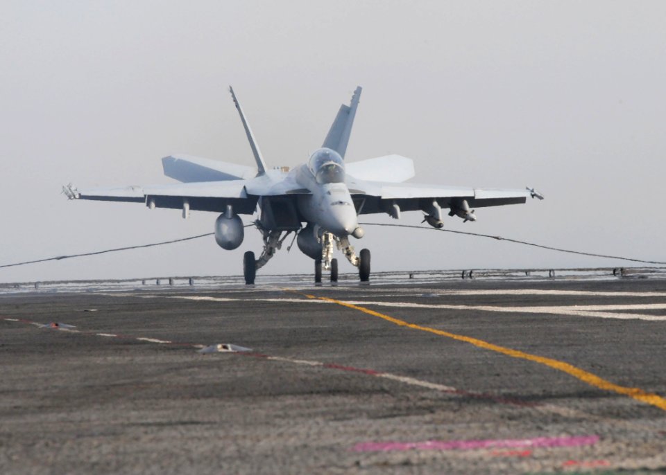 US Navy 110531-N-SG869-489 An F-A-18F Super Hornet assigned to the Black Knights of Strike Fighter Squadron (VFA) 146 makes an arrested landing abo