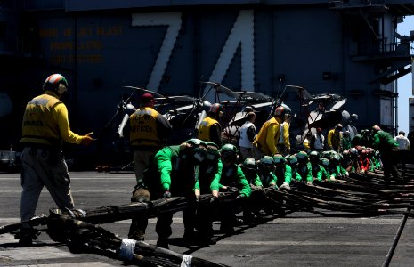 US Navy 110528-N-OY799-523 Sailors set up the barricade during flight deck drills aboard USS John C. Stennis (CVN 74)