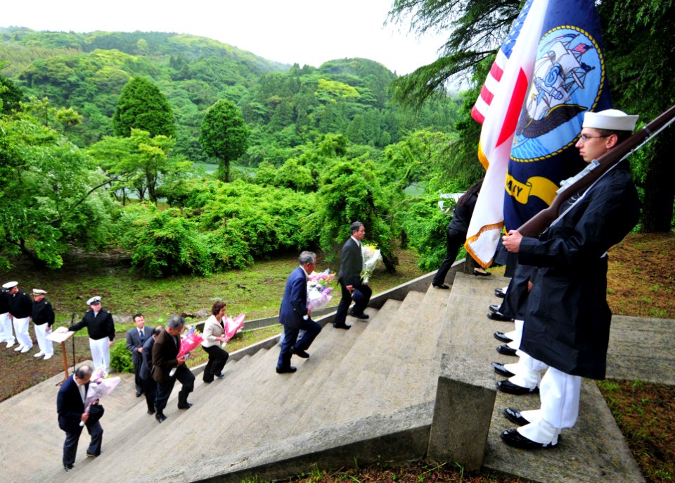 US Navy 110529-N-WJ771-078 Japanese nationals climb the steps of the Soto Dam Memorial during a ceremony for the American prisoners of war and Japa
