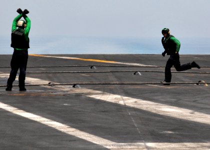 US Navy 110530-N-GL340-073 Sailors check arresting gear cables aboard the aircraft carrier USS Ronald Reagan (CVN 76). Ronald Reagan and Carrier Ai