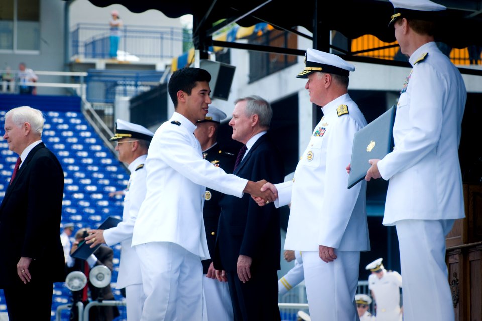 US Navy 110527-N-ZB612-180 Chief of Naval Operations (CNO) Adm. Gary Roughead congratulates newly commissioned ensigns and 2nd lieutenants of the N