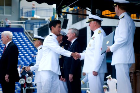 US Navy 110527-N-ZB612-180 Chief of Naval Operations (CNO) Adm. Gary Roughead congratulates newly commissioned ensigns and 2nd lieutenants of the N photo