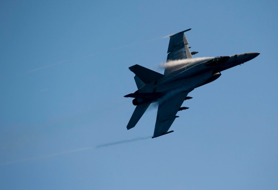 US Navy 110603-N-DR144-126 An F-A-18E Super Hornet maneuvers over USS Carl Vinson (CVN 70) during an air power demonstration