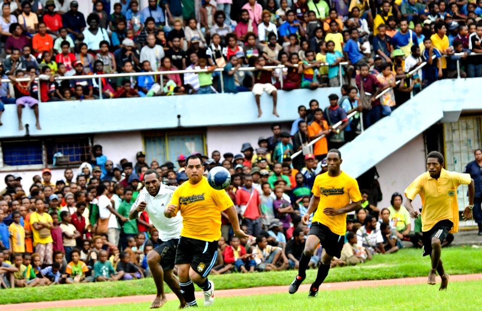 US Navy 110529-O-ZZ999-006 Players run for control of the soccer ball during a exhibition soccer match during Pacific Partnership 2011