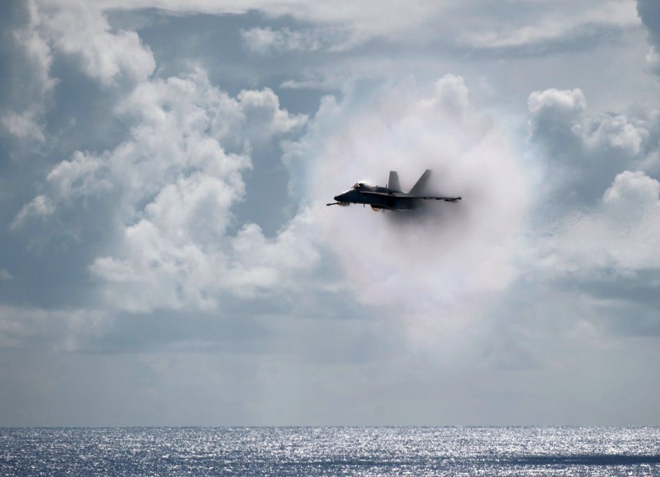 US Navy 110531-N-DR144-595 An F-A-18C Hornet assigned to Strike Fighter Squadron (VFA) 113 breaks the sound barrier over the Nimitz-class aircraft