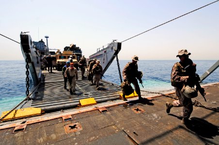 US Navy 110601-N-RC734-164 Marines disembark Landing Craft Utility (LCU) 1648 during stern gate marriage operations aboard USS Comstock (LSD 45)