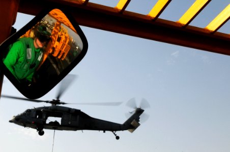 US Navy 110531-N-SB672-242 Logistics Specialist 3rd Class Cole Henry, from Mesquite, Texas, waits in a 6K forklift for an MH-60S Sea Hawk helicopt