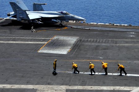 US Navy 110531-N-EE987-003 Sailors scrub foul lines on the flight deck of USS Ronald Reagan (CVN 76)