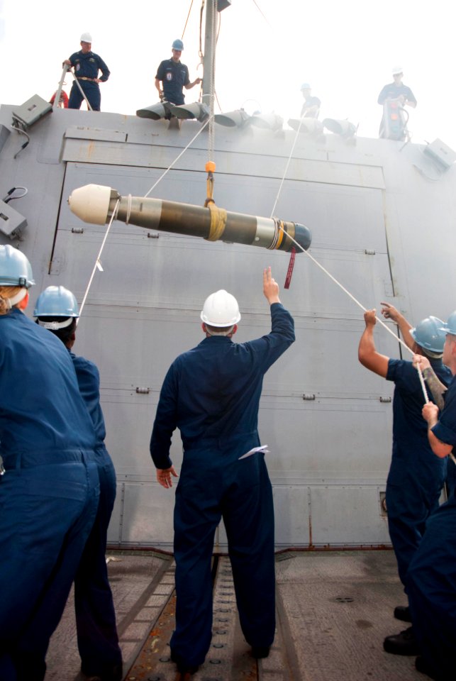 US Navy 110604-N-CB621-195 Sailors aboard USS Chung-Hoon (DDG 93) hoist a Mark 46 type torpedo while underway