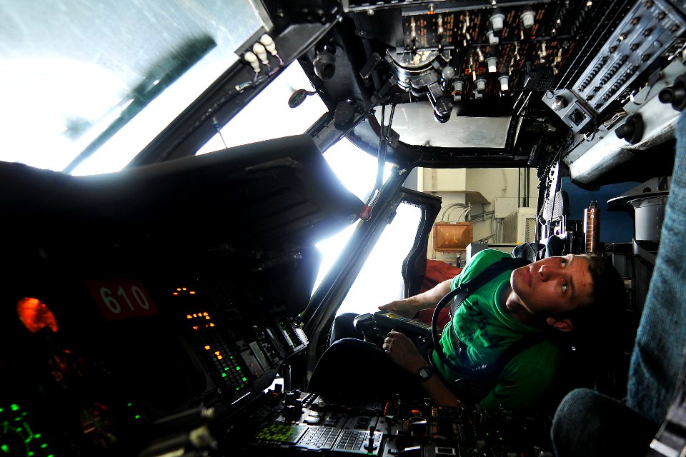 US Navy 110603-N-EE987-037 Aviation Electrician's Mate 2nd Class Jeff Lyons, from Boston, uses an air data test set to inspect circuit breakers on