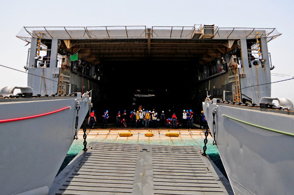 US Navy 110601-N-RC734-253 Landing Craft Utility (LCU) 1632 departs the well deck during stern gate marriage operations aboard USS Comstock (LSD 45