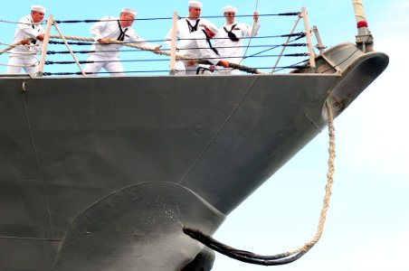 US Navy 110601-N-KT462-571 Sailors aboard the guided-missile destroyer USS Chung Hoon (DDG 93) heave mooring lines before getting underway from Joi