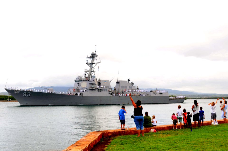 US Navy 110601-N-KT462-656 amily members and friends wave goodbye to Sailors manning the rails aboard the guided-missile destroyer USS Chung Hoon (DDG 93)