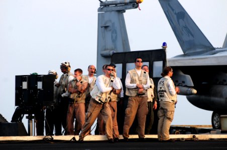 US Navy 110605-N-SB672-191 Landing signal officers watch from the LSO platform as an aircraft lands aboard USS Ronald Reagan (CVN 76)