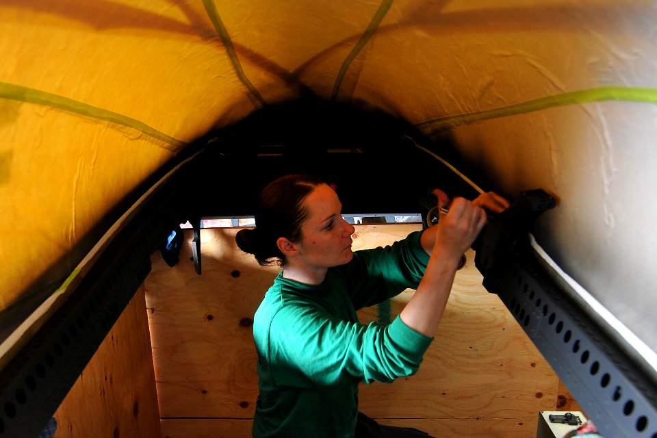 US Navy 110603-N-EE987-003 Aviation Structural Mechanic (Equipment) 2nd Class Jenna Henry, from Pahrump, Nev., installs insulation onto a jet canop