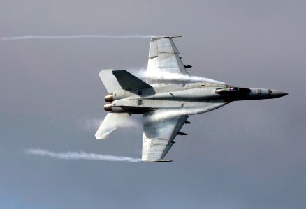 US Navy 110606-N-DR144-350 An F-A-18E Super Hornet assigned to Strike Fighter Squadron (VFA) 81 maneuvers over the Nimitz-class aircraft carrier US