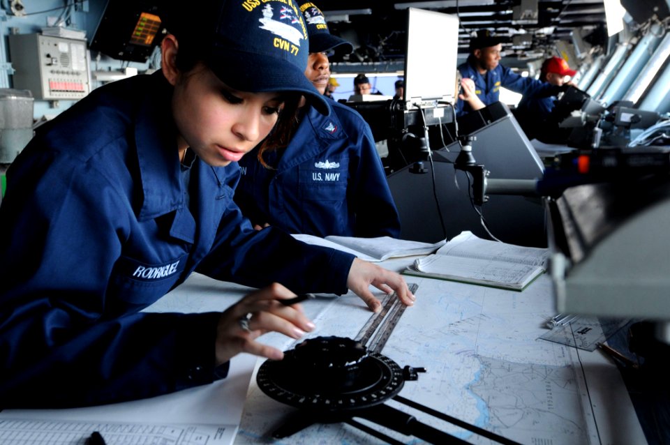US Navy 110604-N-QL471-112 Quartermaster Seaman Angelica Rodriguez plots points on a map aboard the aircraft carrier USS George H.W. Bush (CVN 77)