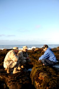 US Navy 110603-N-PM781-008 Lt. Dustin Burton and Lt. Richard Vallejos, both assigned to Maritime Expeditionary Security Squadron (MSRON) 1, work wi