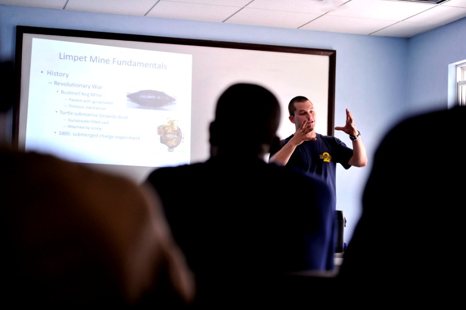 US Navy 110606-N-KB666-245 Navy Diver 2nd Class Zach Dojaquez, assigned to Mobile Dive and Salvage Unit (MDSU) 2, gives a lecture to foreign divers