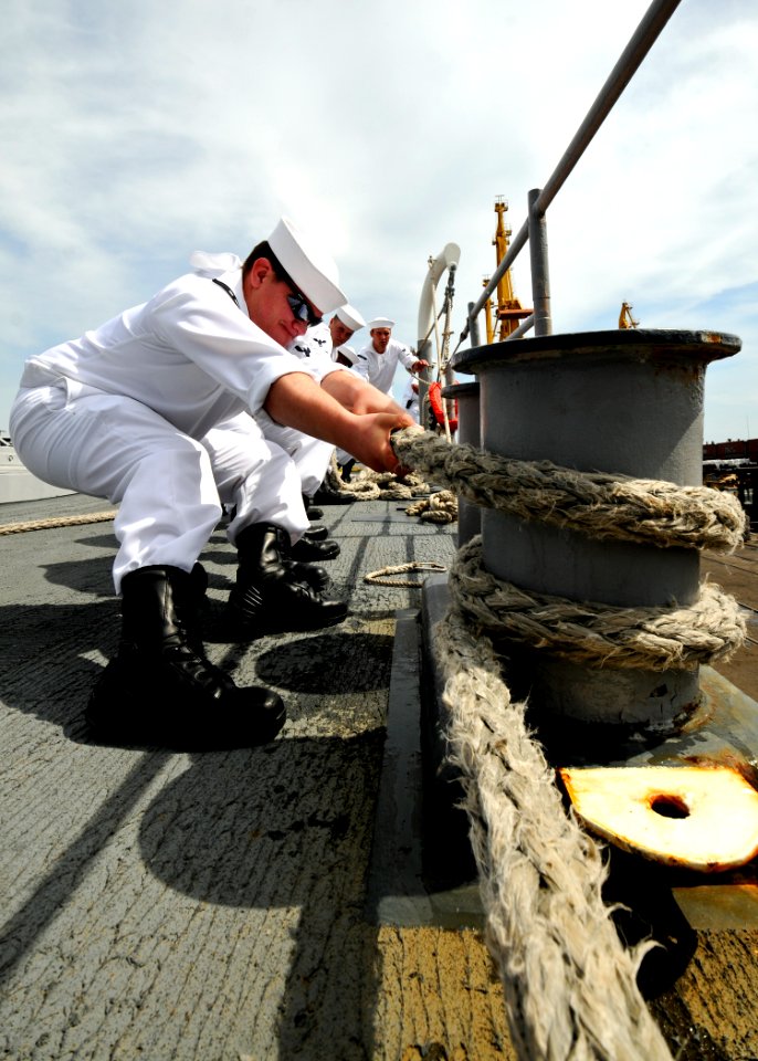 US Navy 110603-N-YM590-060 Sailors aboard USS Anzio (CG 68) heave a line as the ship pulls into Odessa, Ukraine, for a port visit