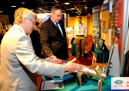 US Navy 110606-N-PO203-031 Dr. Jerome Fanucci, chief executive officer of Kazak Composites, Inc., explains his company's products to Undersecretary