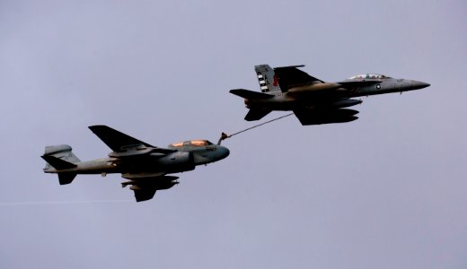 US Navy 110606-N-TU221-555 An F-A-18F Super Hornet assigned to Strike Fighter Squadron (VFA) 22 performs an aerial refueling with an EA-6B Prowler