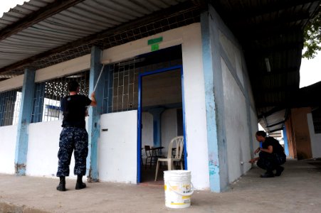 US Navy 110605-F-ET173-186 Sailors embarked aboard the Military Sealift Command hospital ship USNS Comfort (T-AH 20) paint the walls of Institucion photo