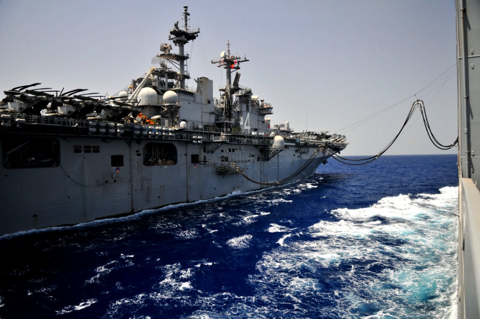 US Navy 110606-N-ZS026-001 The Military Sealift Command dry cargo and ammunition ship USNS Alan Shepard (T-AKE 3), right, refuels the amphibious as