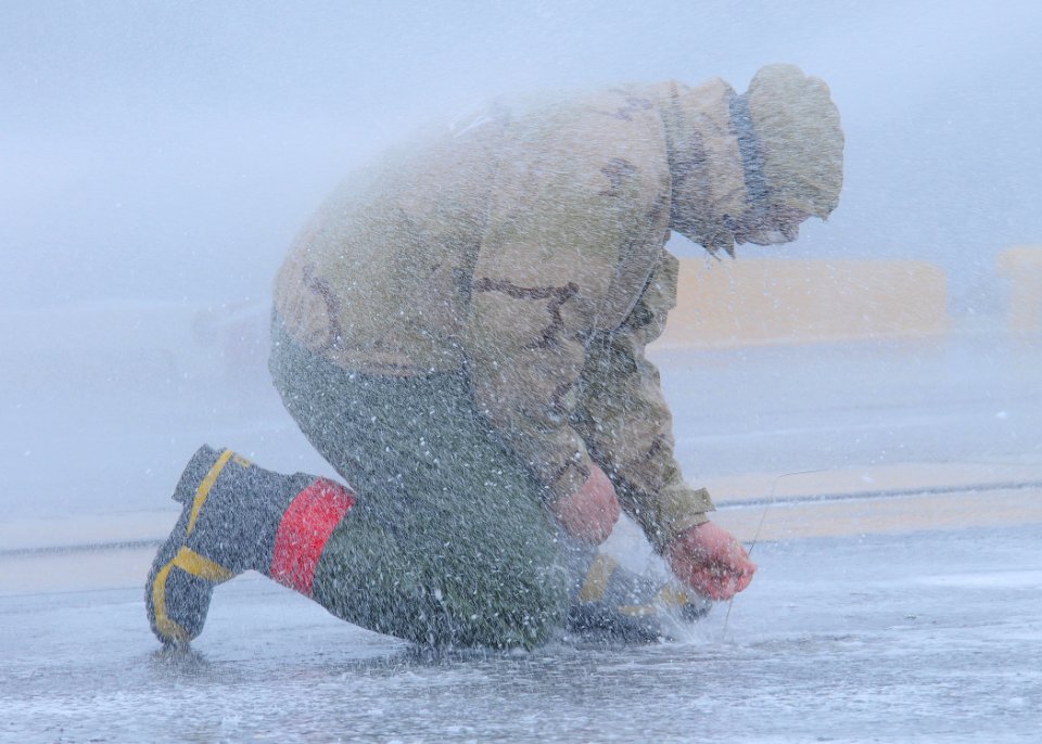 US Navy 110605-N-DS193-003 A Sailor aboard the aircraft carrier USS George Washington (CVN 73) uses a metal scribe to clean debris from a spray noz