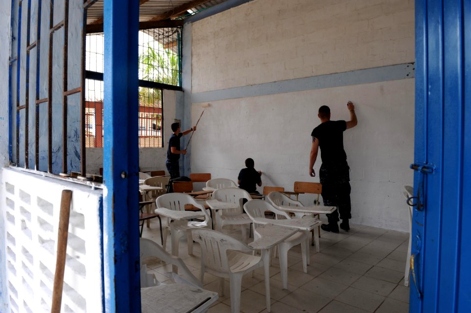 US Navy 110605-F-ET173-217 Sailors embarked aboard the Military Sealift Command hospital ship USNS Comfort (T-AH 20) paint the walls of Institucion