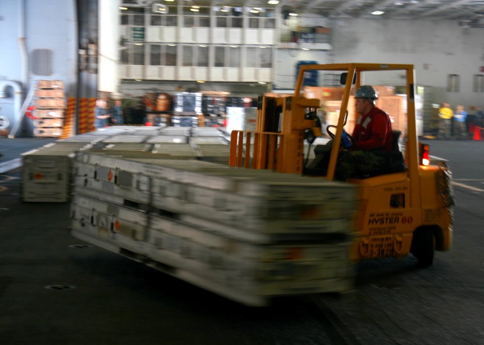 US Navy 110606-N-JO245-026 Aviation Ordnanceman 3rd Class Nick Farada, from Stroudsburg, Pa., moves ordnance in the hangar bay during a weapons on