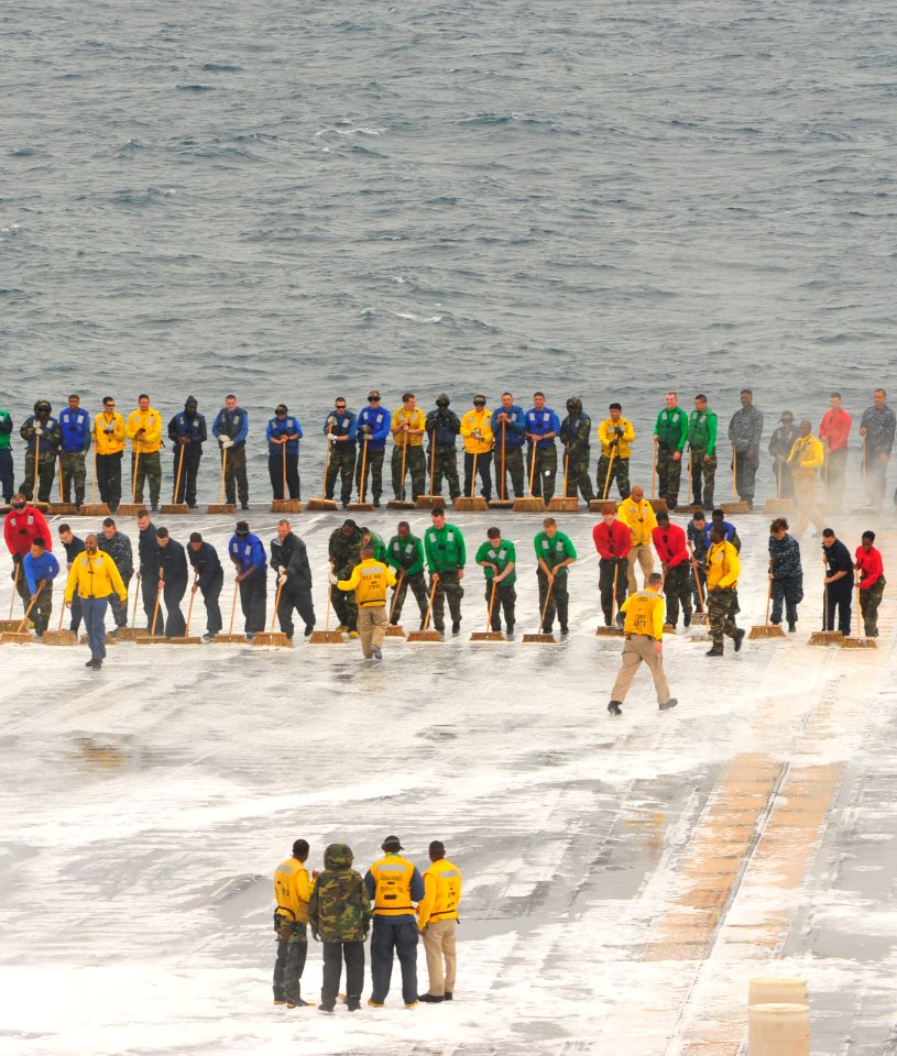 US Navy 110605-N-MH885-012 Sailors aboard the aircraft carrier USS George Washington (CVN 73) scrub the ship's flight deck during a test of the shi