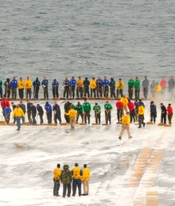 US Navy 110605-N-MH885-012 Sailors aboard the aircraft carrier USS George Washington (CVN 73) scrub the ship's flight deck during a test of the shi