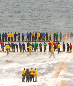 US Navy 110605-N-MH885-012 Sailors aboard the aircraft carrier USS George Washington (CVN 73) scrub the ship's flight deck during a test of the shi photo