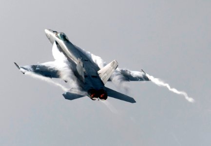 US Navy 110606-N-DR144-314 An F-A-18E Super Hornet assigned to Strike Fighter Squadron (VFA) 81 maneuvers over the Nimitz-class aircraft carrier US