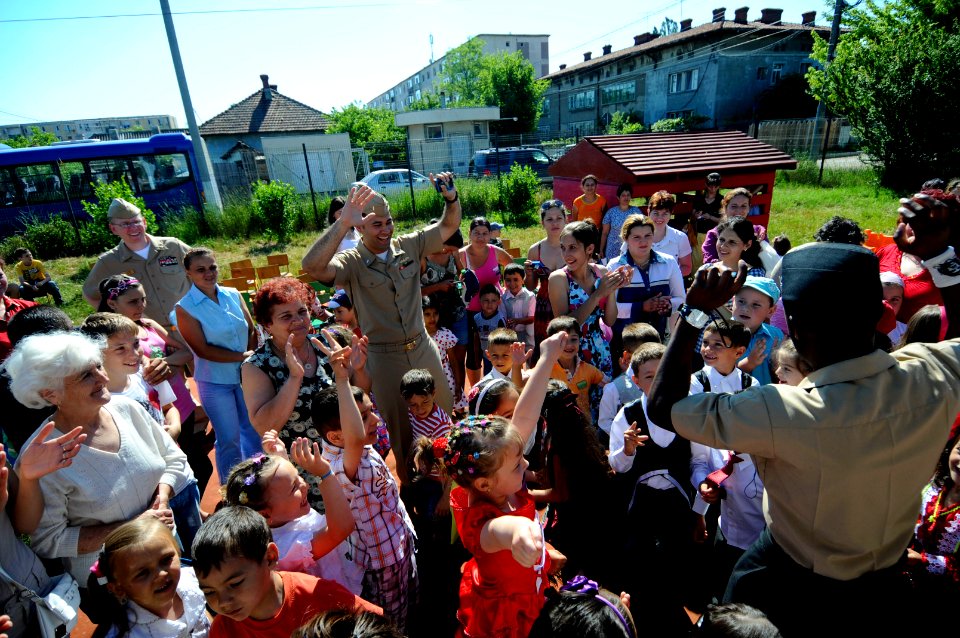 US Navy 110608-N-AQ172-338 Sailors dance together with children from the Constanta Kindergarden ^31 class during a community service project