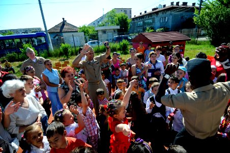US Navy 110608-N-AQ172-338 Sailors dance together with children from the Constanta Kindergarden ^31 class during a community service project