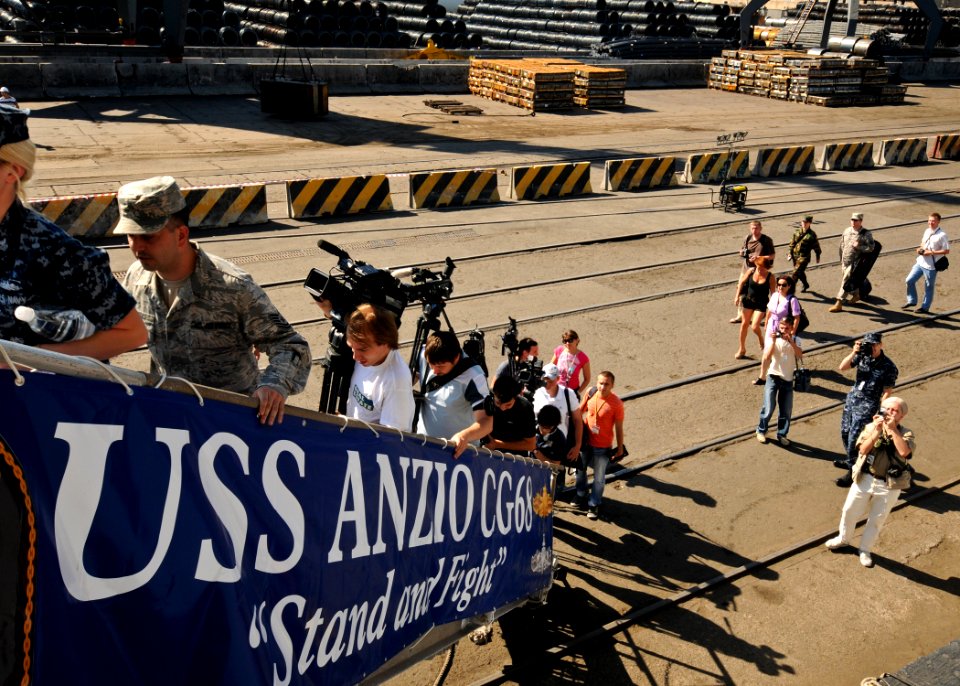 US Navy 110607-N-YM590-022 Local media boards USS Anzio (CG 68) for a tour of the ship in Odessa, Ukraine, during a port visit