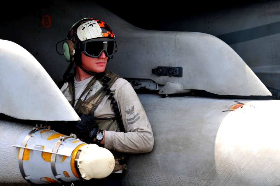 US Navy 110608-N-GL340-016 Aviation Support Equipment Technician 2nd Class John Seelback, from Splendosa, Texas, waits to guide aircraft on the fli