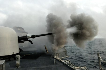 US Navy 110606-N-NL541-341 The MK-75 76mm mounted gun aboard USS Thach (FFG 43) is fired during a live-fire exercise off the coast of Chile
