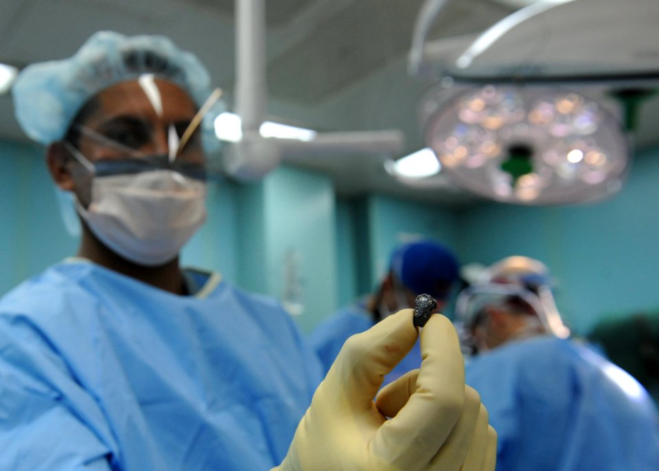 US Navy 110608-N-NY820-060 ospital Corpsman 2nd Class Juan Sanchez holds a bullet removed from a 23-year-old Colombian woman's cheek during a Conti