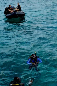 US Navy 110607-N-KB666-173 Multination divers from the Caribbean conduct a hull search of a suspicious vessel during a training exercise with Mobile