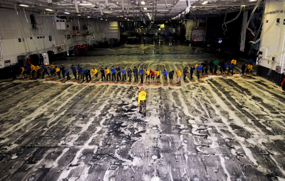 US Navy 110605-N-SF704-214 Sailors aboard the aircraft carrier USS George Washington (CVN 73) scrub the ship's hangar bay during a test of the ship