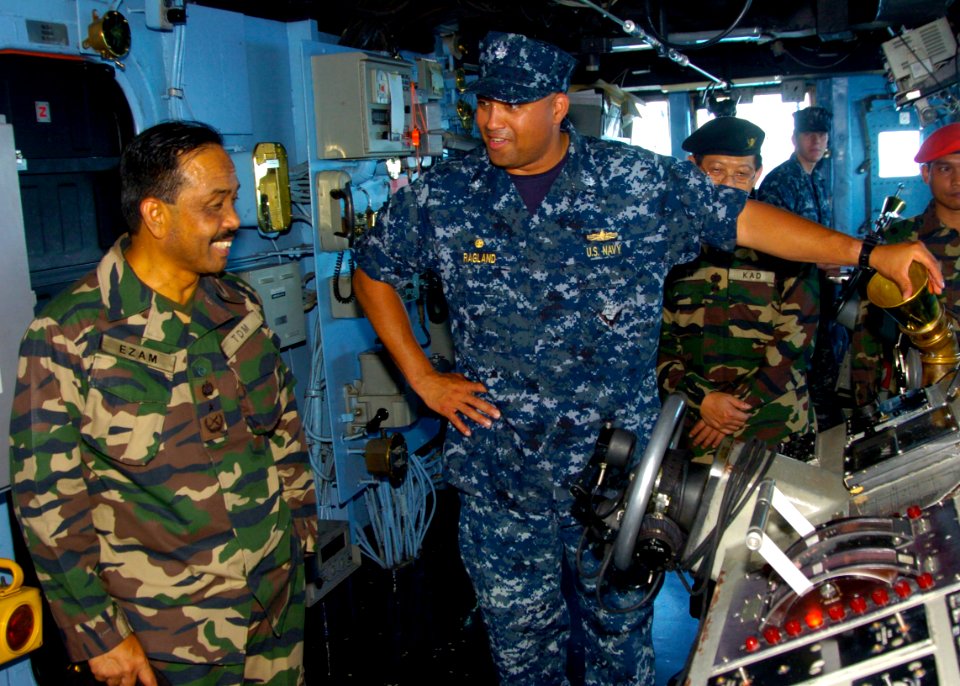 US Navy 110607-N-VY256-031 Cmdr. Adrian Ragland, commanding officer of the amphibious dock landing ship USS Tortuga (LSD 46), explains Boatswain's
