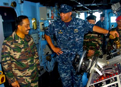 US Navy 110607-N-VY256-031 Cmdr. Adrian Ragland, commanding officer of the amphibious dock landing ship USS Tortuga (LSD 46), explains Boatswain's photo