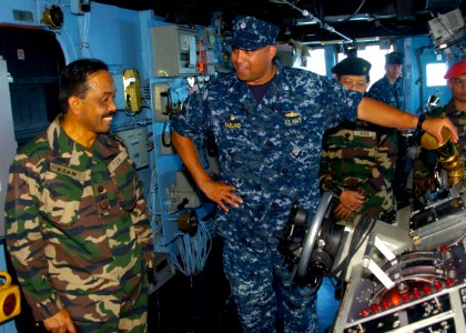 US Navy 110607-N-VY256-031 Cmdr. Adrian Ragland, commanding officer of the amphibious dock landing ship USS Tortuga (LSD 46), explains Boatswain's